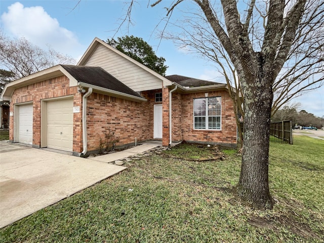 ranch-style home featuring a garage and a front yard