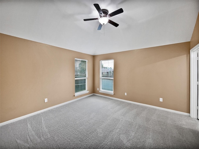 spare room featuring carpet flooring and ceiling fan