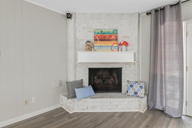 room details with wood-type flooring, a fireplace, and wooden walls