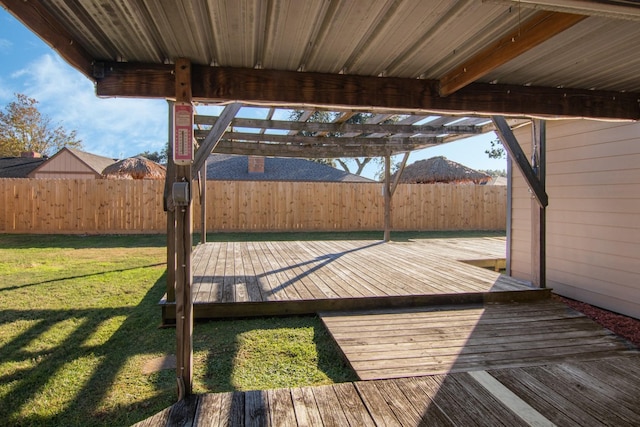 wooden deck featuring a pergola and a lawn