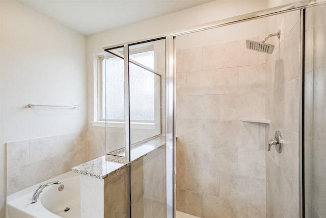 bathroom with independent shower and bath