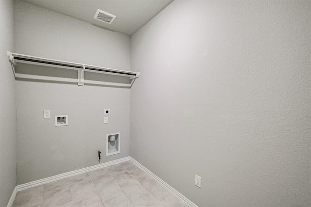 clothes washing area featuring hookup for a gas dryer, washer hookup, and hookup for an electric dryer