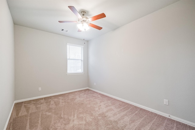 unfurnished room with light carpet and ceiling fan