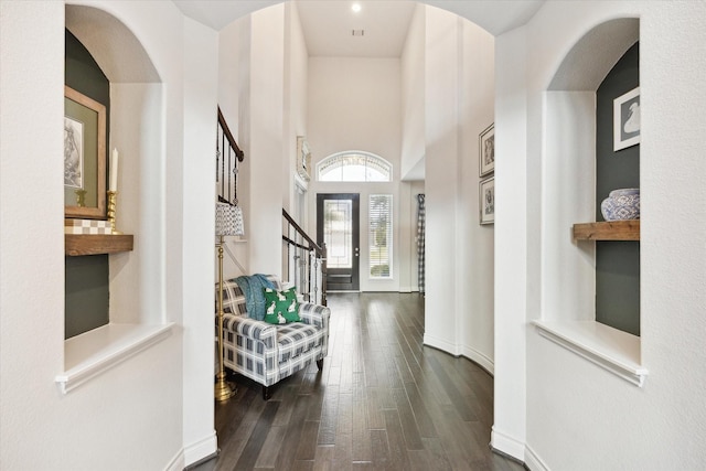 hallway with dark hardwood / wood-style flooring