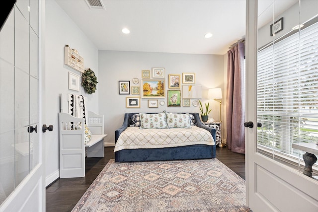 bedroom with french doors, a closet, and dark hardwood / wood-style floors