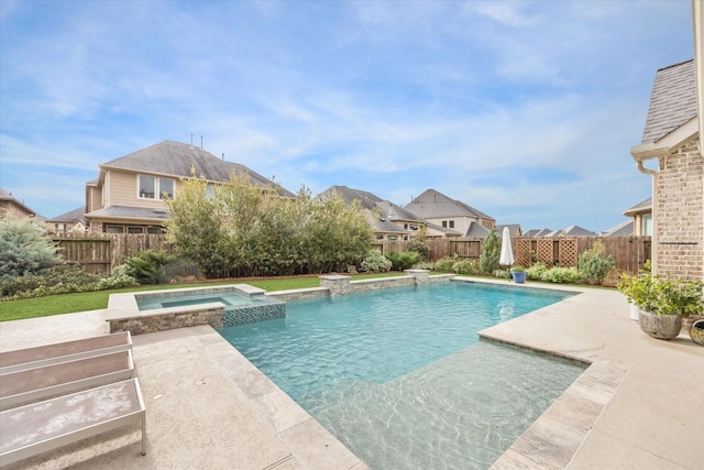 view of swimming pool featuring a patio and an in ground hot tub