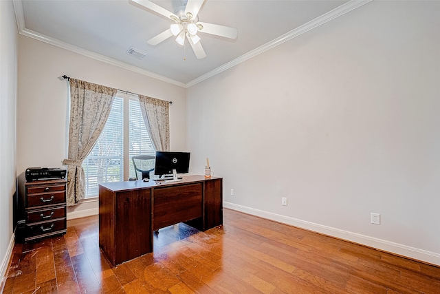 home office featuring ceiling fan, ornamental molding, and hardwood / wood-style flooring