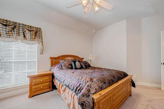 carpeted bedroom with lofted ceiling and ceiling fan