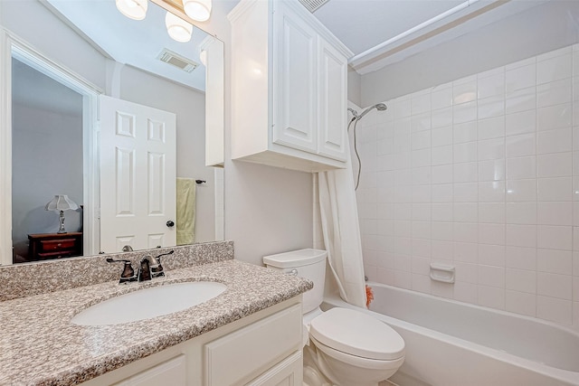 full bathroom with toilet, shower / tub combo with curtain, and vanity