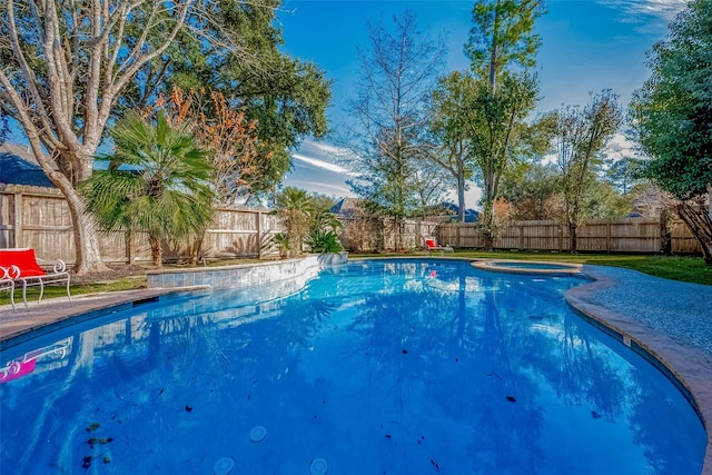 view of pool with an in ground hot tub