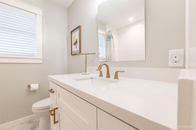 bathroom with vanity, toilet, and a shower with shower curtain