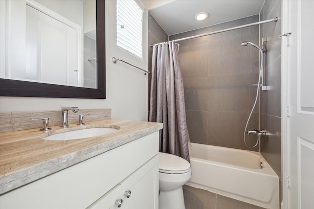 full bathroom with toilet, vanity, and shower / bath combo