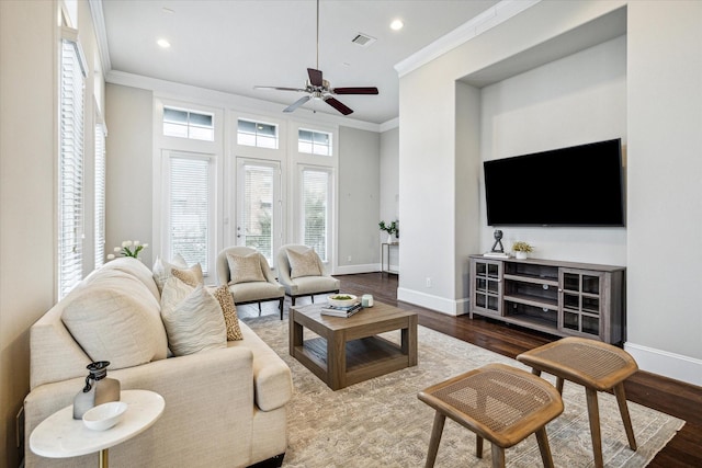 living room featuring hardwood / wood-style floors, ceiling fan, and ornamental molding