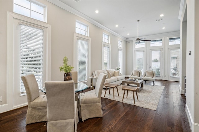 dining area featuring ceiling fan, crown molding, and dark hardwood / wood-style floors