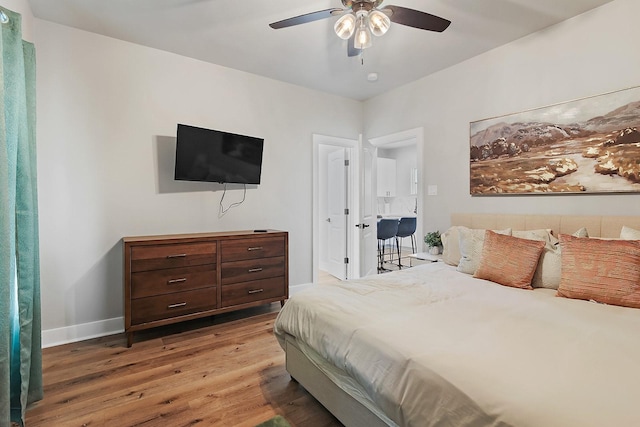 bedroom featuring hardwood / wood-style flooring and ceiling fan