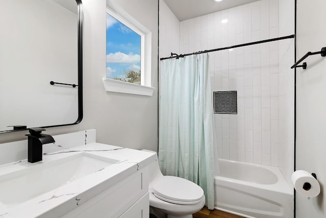 full bathroom featuring vanity, shower / tub combo, and toilet