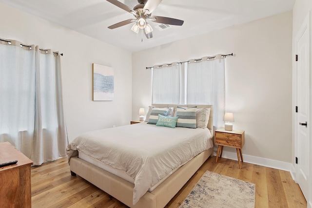 bedroom featuring ceiling fan and light wood-type flooring