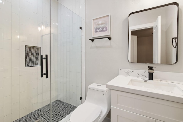 bathroom with vanity, toilet, and walk in shower