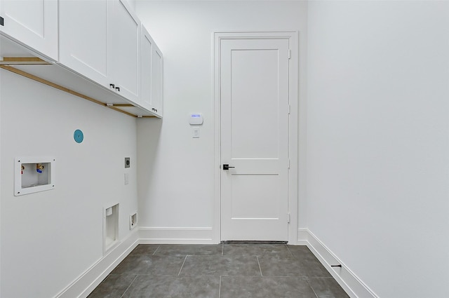 laundry room featuring electric dryer hookup, hookup for a washing machine, cabinets, and tile patterned flooring