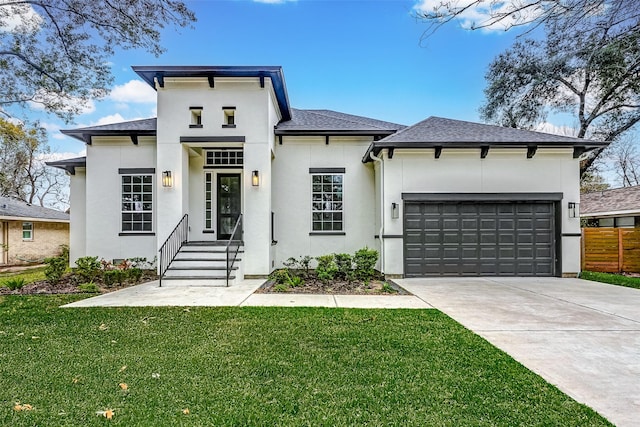 view of front of house with a front yard and a garage