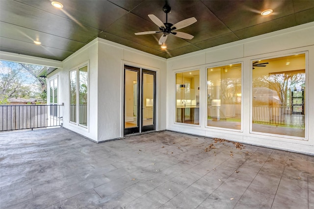 view of patio featuring french doors and ceiling fan