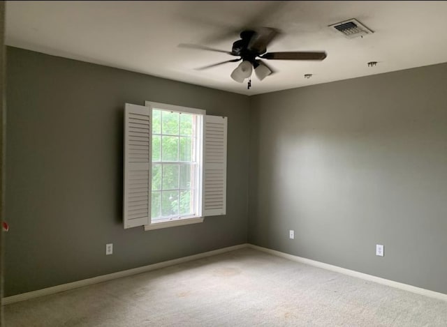 spare room with carpet flooring and ceiling fan