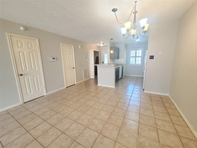 interior space featuring light tile patterned floors, visible vents, decorative light fixtures, light countertops, and a chandelier