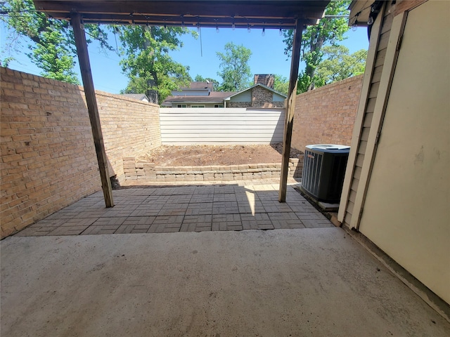 view of patio featuring central AC and a fenced backyard