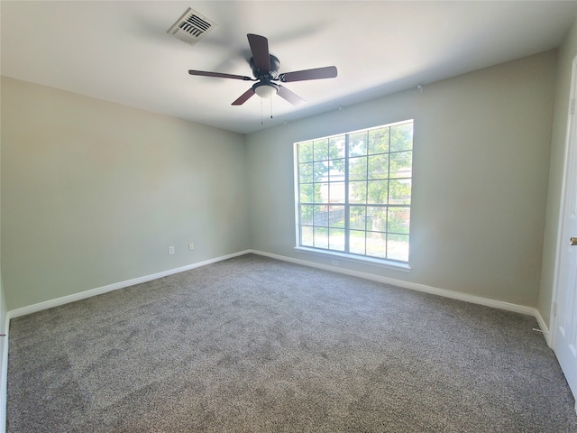 2030 Plantation Dr Unit B-2, Conroe, TX 77301 - carpeted spare room featuring ceiling fan and baseboards