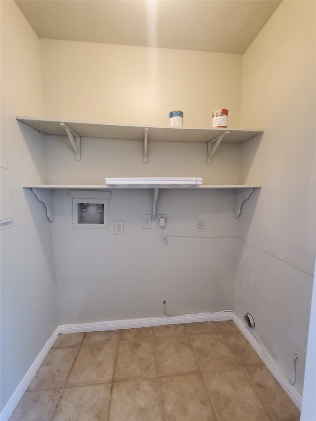 2030 Plantation Dr Unit B-2, Conroe, TX 77301 - laundry room with hookup for an electric dryer, hookup for a washing machine, gas dryer hookup, baseboards, and light tile patterned flooring