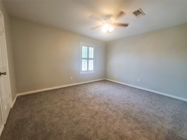 2030 Plantation Dr Unit B-2, Conroe, TX 77301 - unfurnished room with a ceiling fan, dark carpet, and baseboards