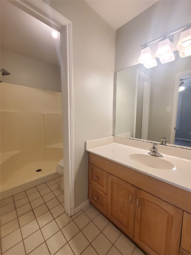 2030 Plantation Dr Unit B-2, Conroe, TX 77301 - full bathroom with tile patterned floors, walk in shower, vanity, and toilet