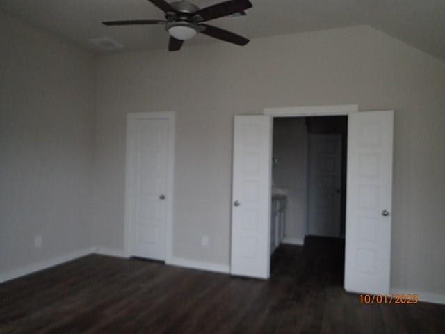 unfurnished bedroom with dark hardwood / wood-style floors, ceiling fan, and lofted ceiling