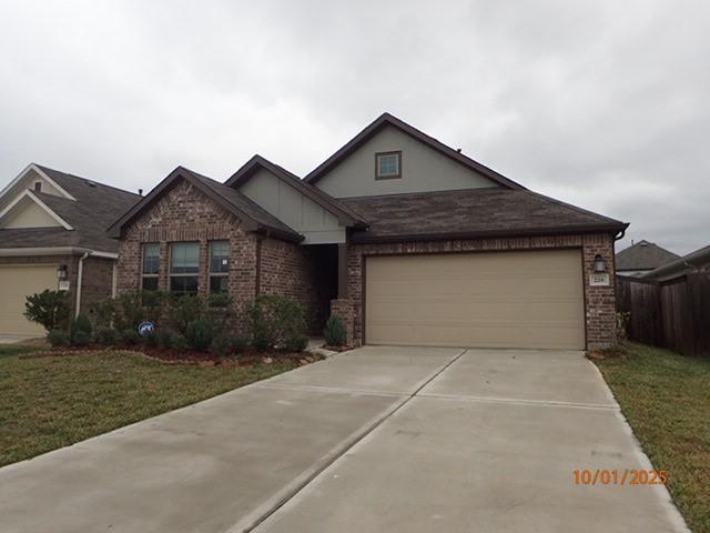 view of front of house with a front lawn and a garage