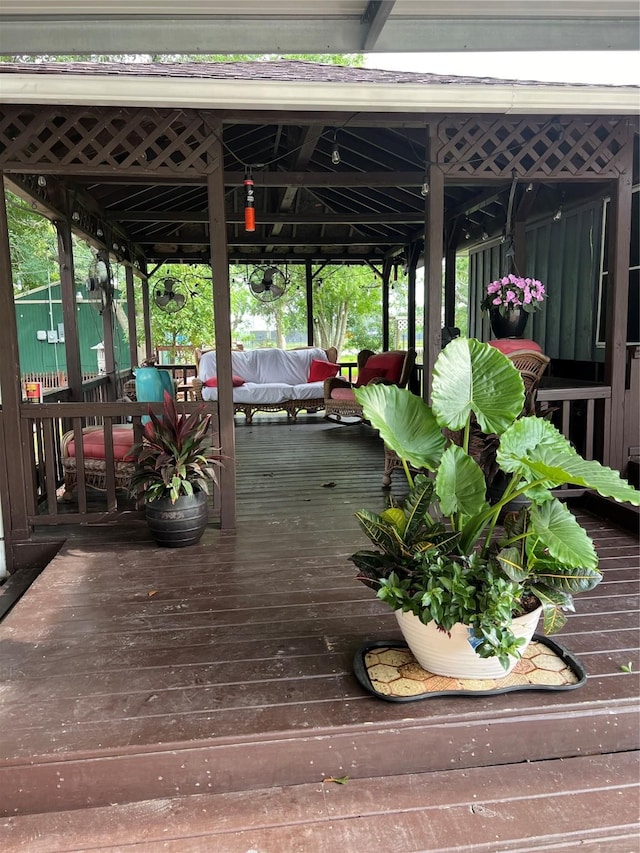 exterior space featuring a gazebo and a wooden deck