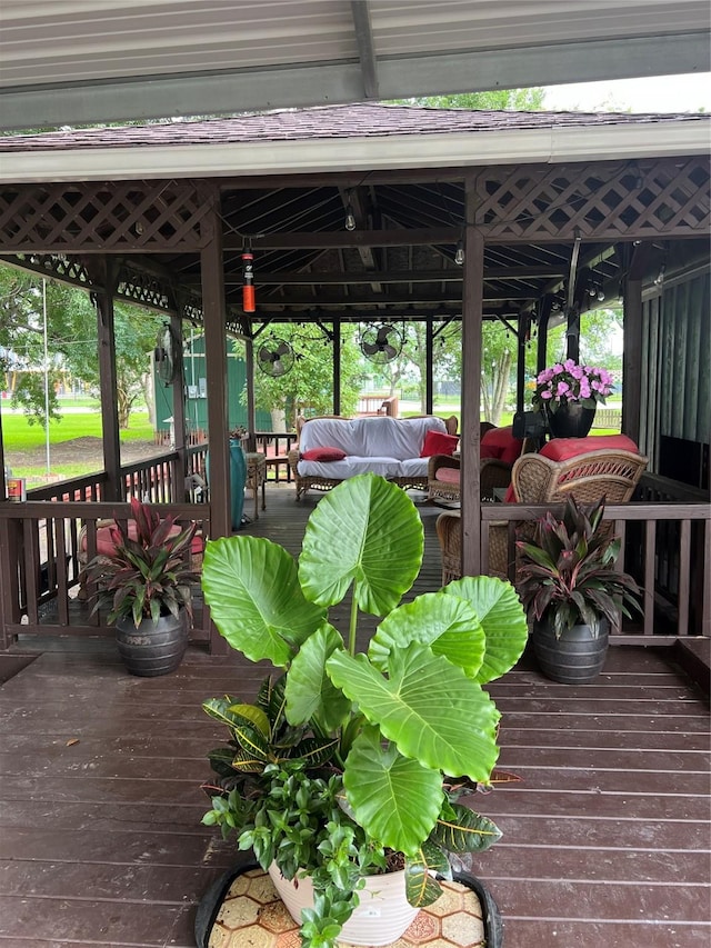 deck featuring a gazebo and outdoor lounge area