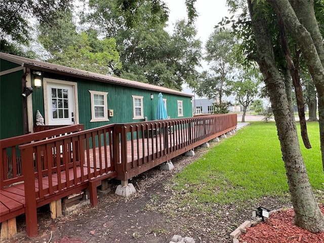 exterior space with a yard and a wooden deck