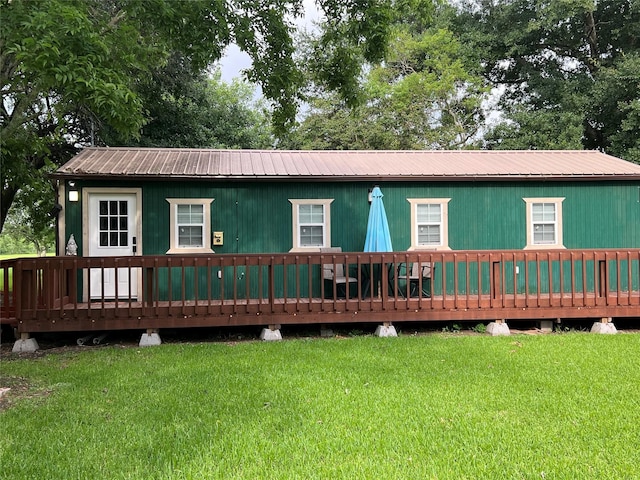 rear view of house with a lawn