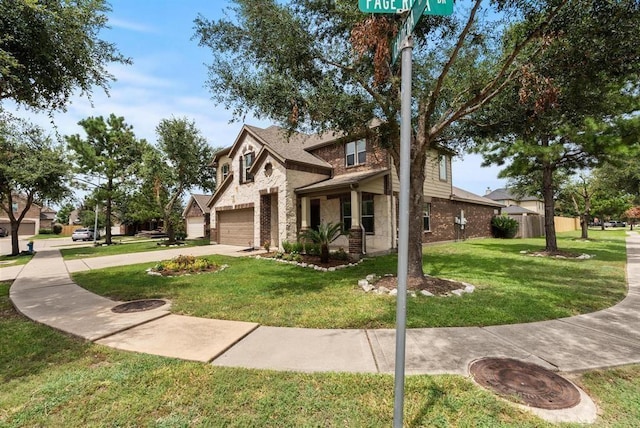 view of front of home with a front yard and a garage