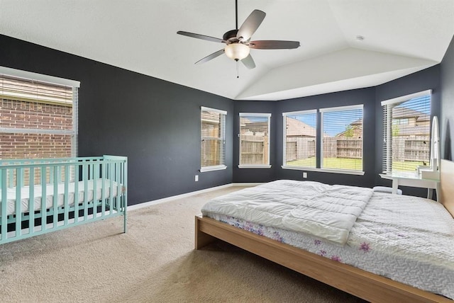 bedroom featuring ceiling fan, carpet, and vaulted ceiling