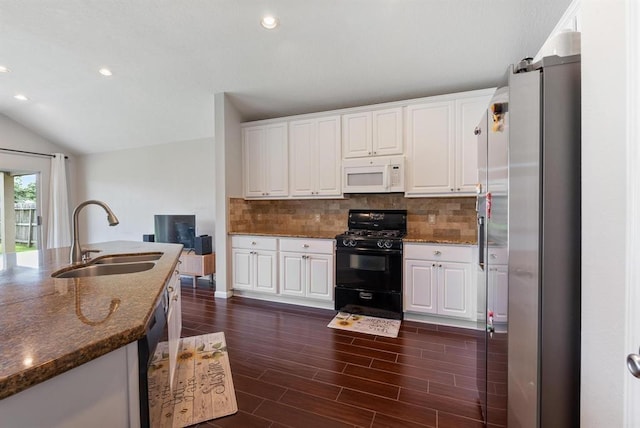 kitchen featuring white cabinets, appliances with stainless steel finishes, and sink