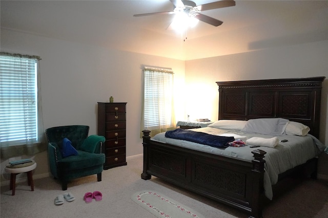 bedroom featuring ceiling fan and light colored carpet