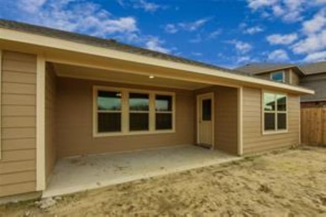 rear view of house featuring a patio