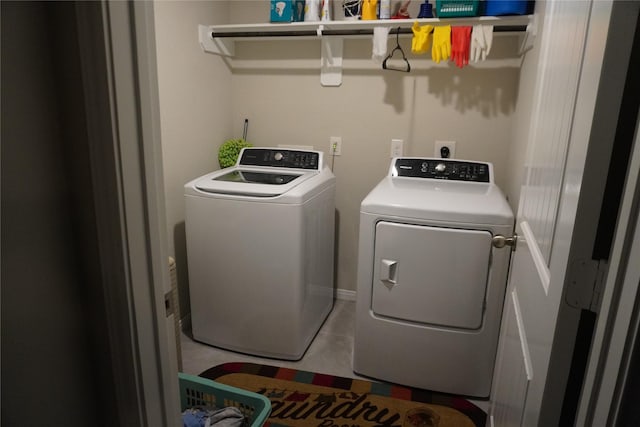 laundry room featuring separate washer and dryer