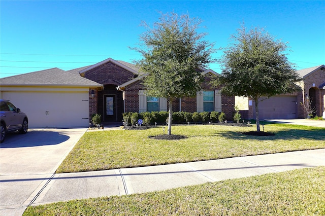 view of front of home featuring a garage and a front lawn