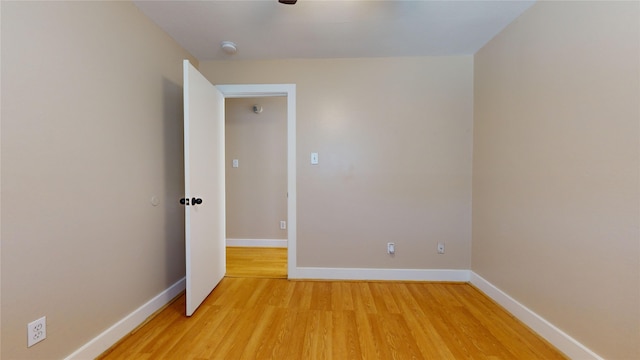 empty room with hardwood / wood-style floors