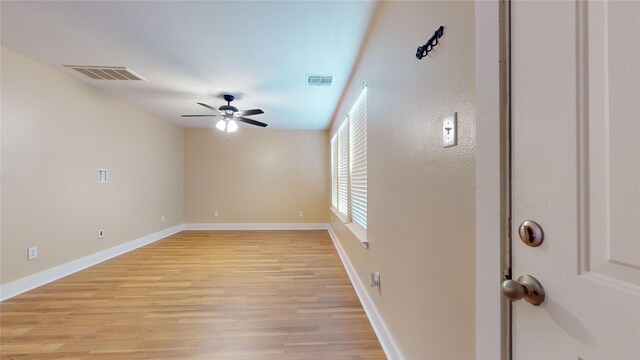 unfurnished room featuring ceiling fan and light wood-type flooring