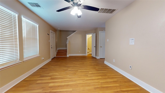 spare room with ceiling fan and light hardwood / wood-style flooring