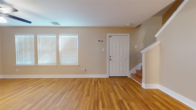 entryway with ceiling fan and light hardwood / wood-style floors