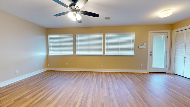 unfurnished room featuring hardwood / wood-style floors and ceiling fan